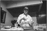 1995 Wendy Gilbert, chef/owner of the Savoy Truffle adds a final touch of spices