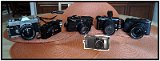 From left to right: Canon FTb, Olympus XAII, Leica M-6, Lumix GF1, Fuji X-E2. Front: Canon Powershot S70